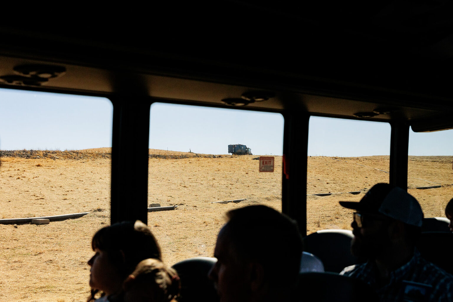 Image shot from the inside of a bus, attendees exploring WPWMA's waste sorting facility and recycling operations.