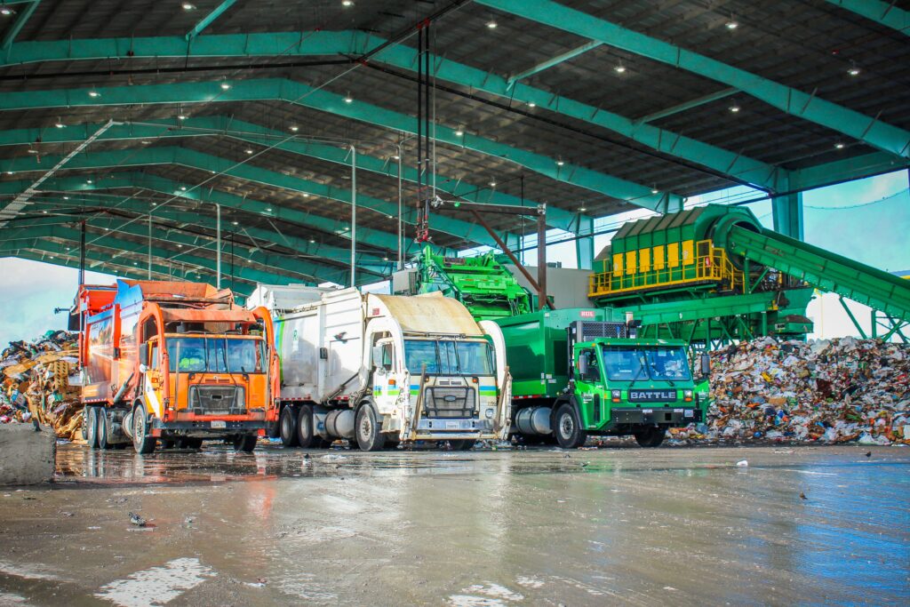 Three garbage trucks at the Western Placer Waste Management Authority recycling facility